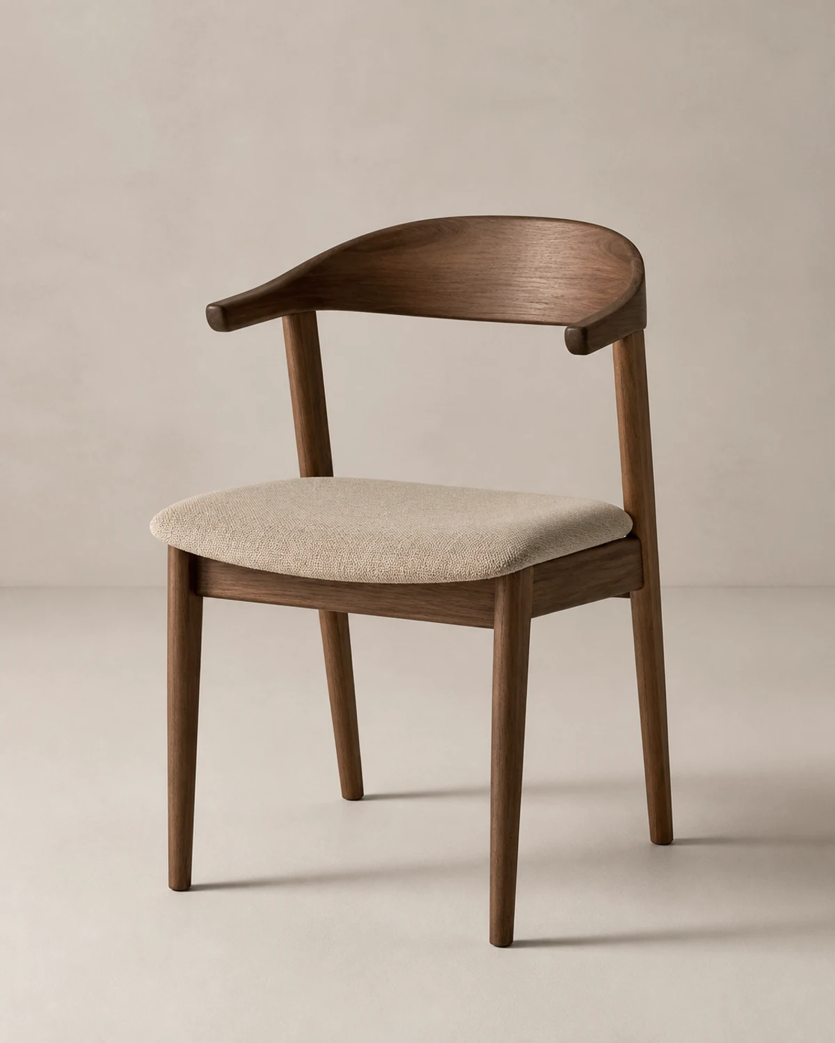 Walnut frame dining chair with neutral woven upholstery
